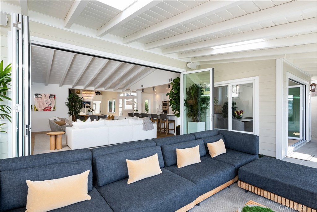 56 Balboa Coves Newport Beach, CA 92663 - Photo 12 of 34 Outdoor Living Area with Newly Installed La Cantina Bi-Fold Doors to Bring the Outside In.
Furnished by Restoration Hardware Included with Home