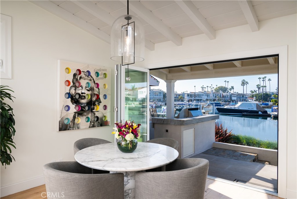 56 Balboa Coves Newport Beach, CA 92663 - Photo 13 of 34 Breakfast Area with Water View Opens to Outdoor Barbecue