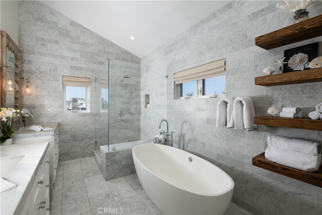 56 Balboa Coves Newport Beach, CA 92663 - Photo 20 of 34 Primary Bath with Soaking Tub and Glass Enclosed Shower