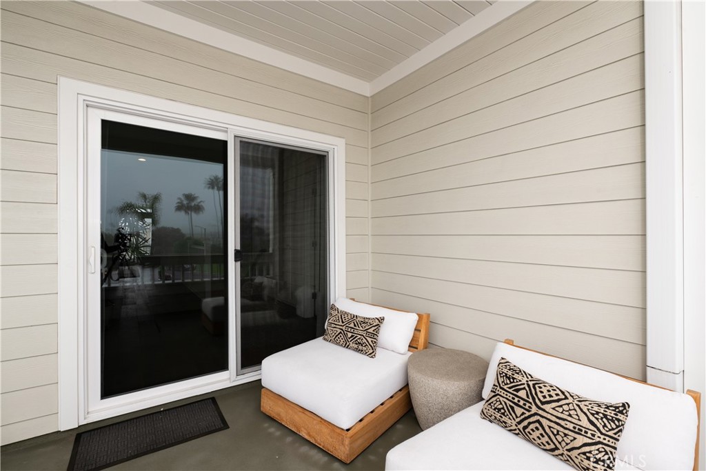 56 Balboa Coves Newport Beach, CA 92663 - Photo 27 of 34 Front Balcony Overlooks Park Across the Street