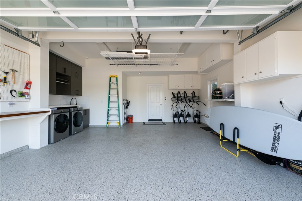56 Balboa Coves Newport Beach, CA 92663 - Photo 30 of 34 Two Car Garage with Plenty of Storage for Bikes and Paddleboards