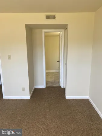 a white toilet sitting next to a sink