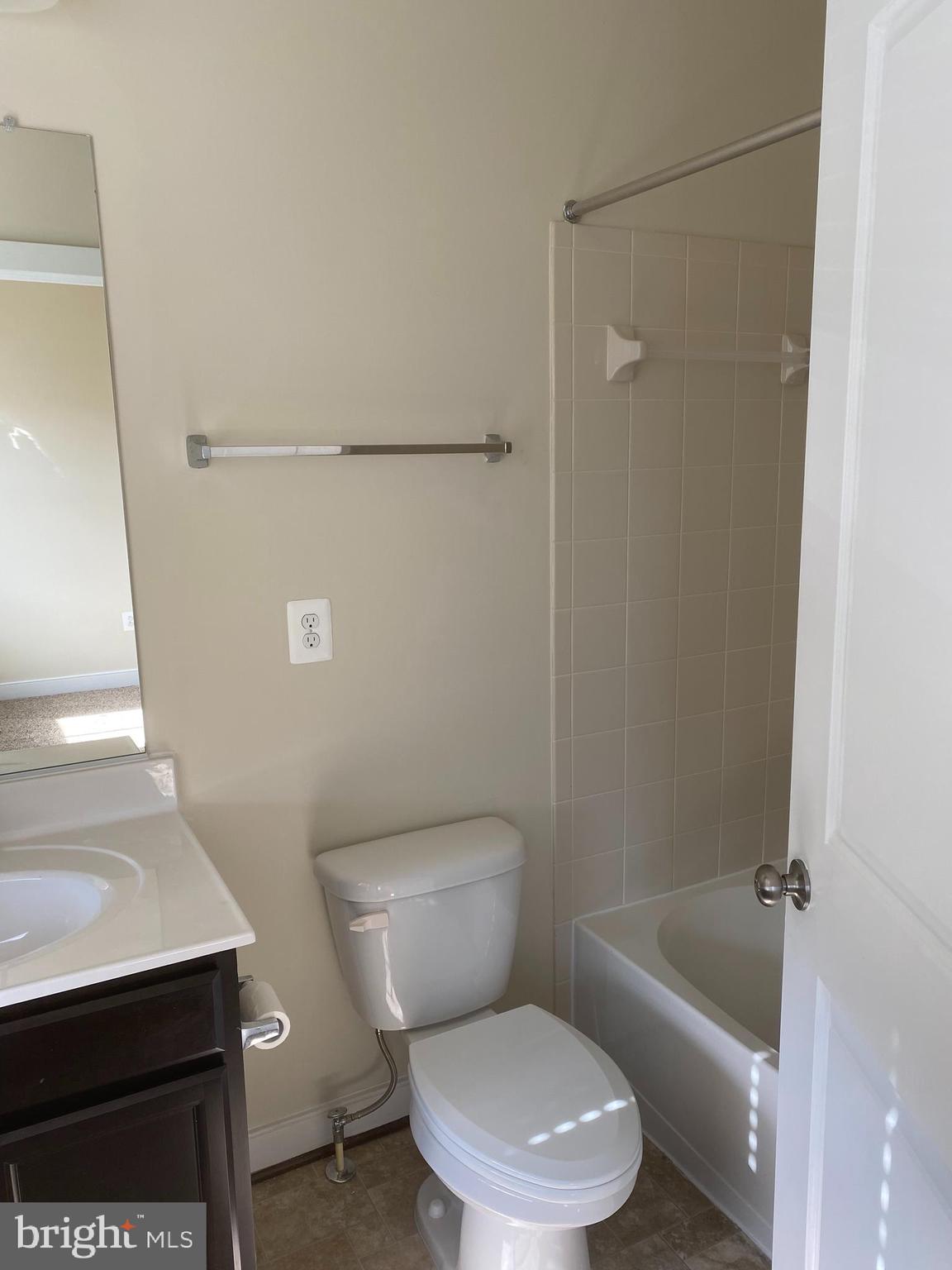 200 Chesterfield Lane, Unit 203 Stafford, VA 22556 - Photo 16 of 27 a white toilet sitting next to a bath tub
