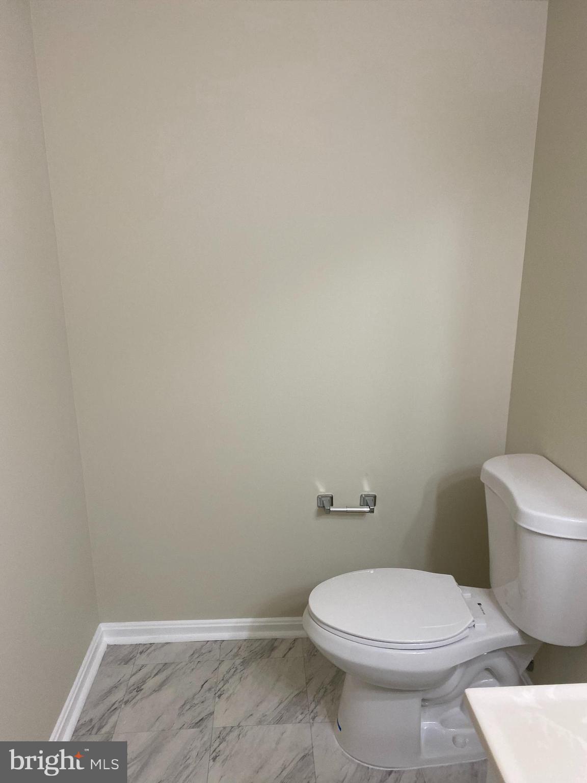 200 Chesterfield Lane, Unit 203 Stafford, VA 22556 - Photo 18 of 27 a white toilet sitting next to a shower