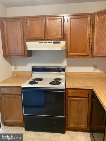 a bathroom with a sink and cabinets