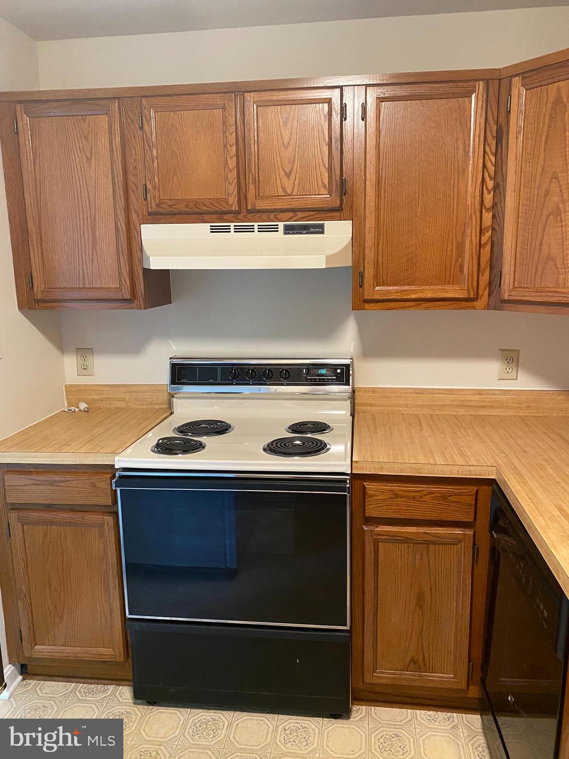 200 Chesterfield Lane, Unit 203 Stafford, VA 22556 - Photo 21 of 27 a kitchen with a stove and a sink