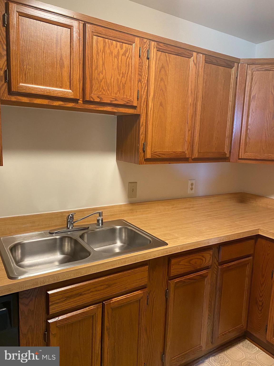 200 Chesterfield Lane, Unit 203 Stafford, VA 22556 - Photo 22 of 27 a kitchen with a sink and cabinets