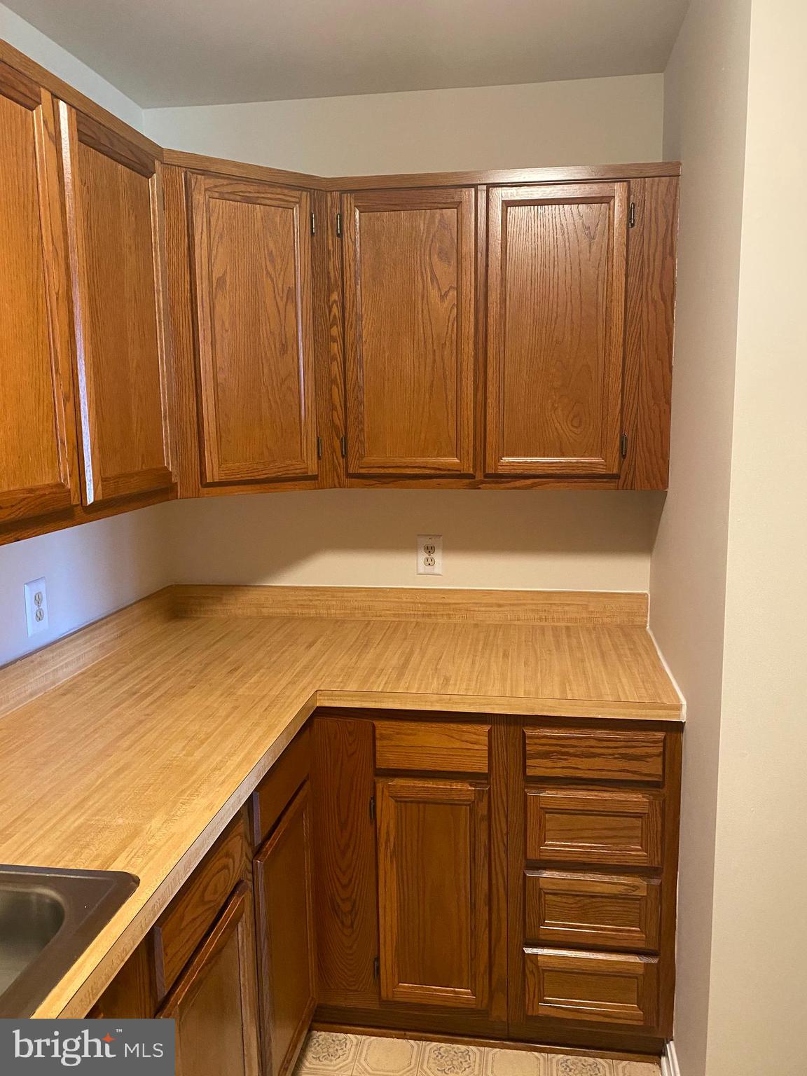 200 Chesterfield Lane, Unit 203 Stafford, VA 22556 - Photo 23 of 27 a bathroom with a sink and cabinets