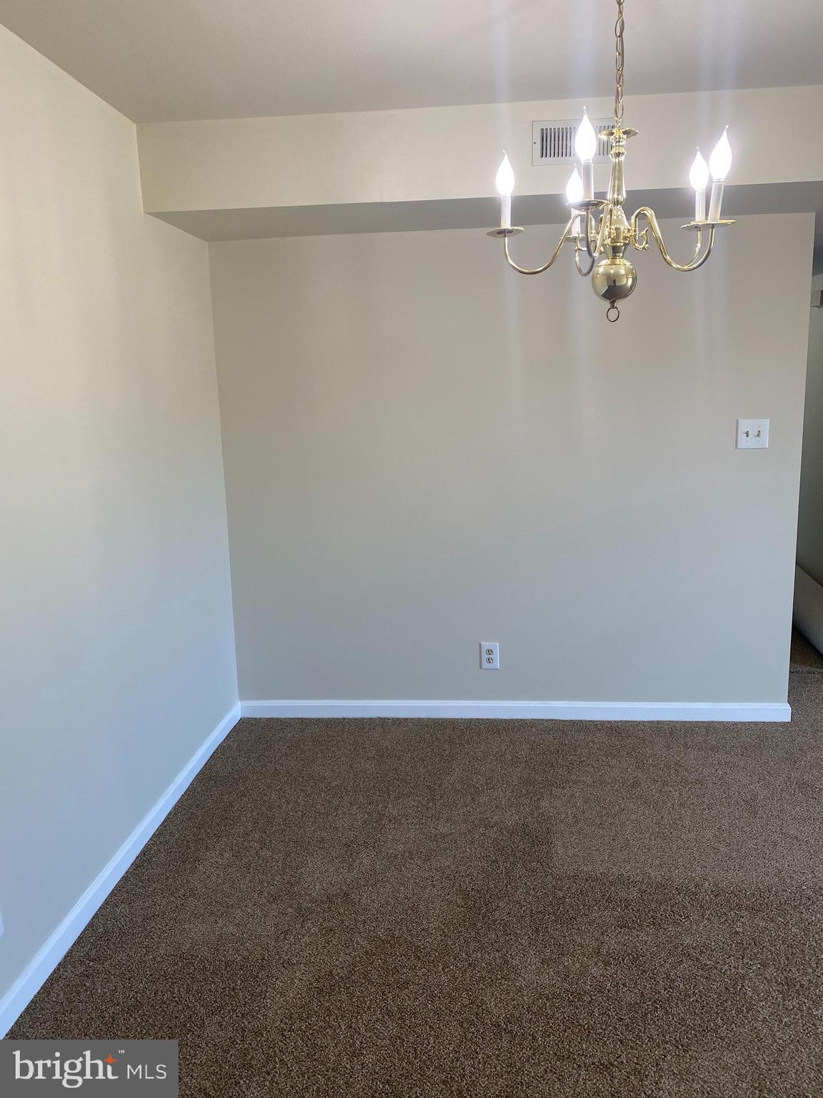 200 Chesterfield Lane, Unit 203 Stafford, VA 22556 - Photo 5 of 27 a view of a chandelier fan and refrigerator