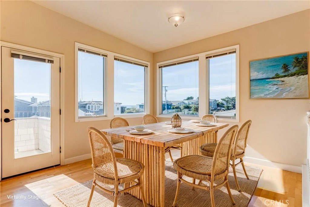 305 Ivar Street Cambria, CA 93428 - Photo 11 of 69 a dining room with furniture a chandelier and wooden floor