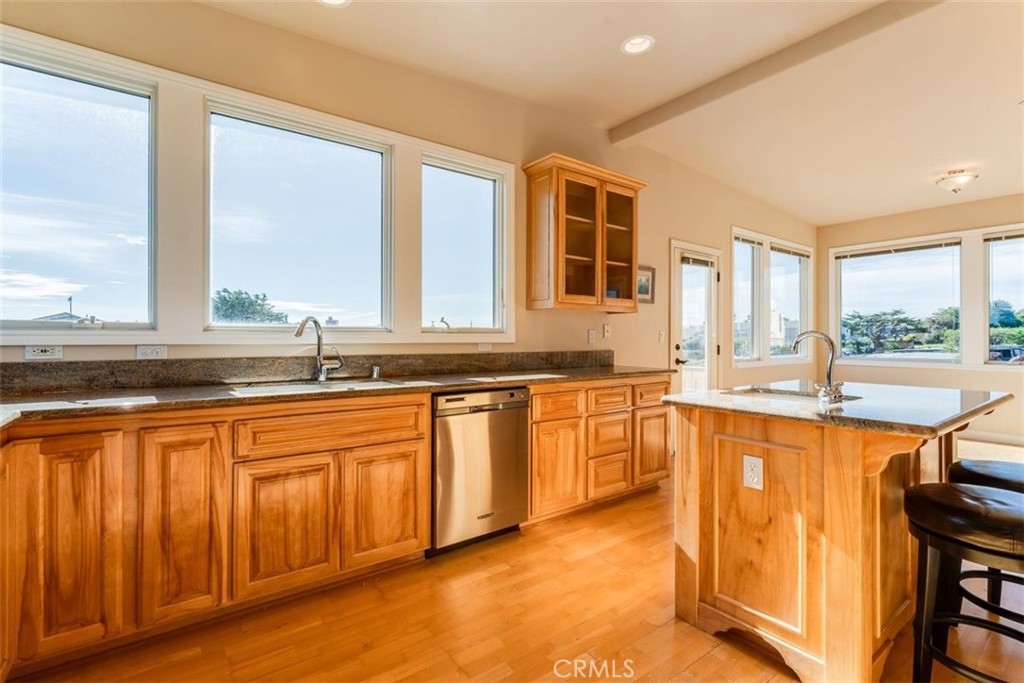 305 Ivar Street Cambria, CA 93428 - Photo 25 of 69 a large kitchen with granite countertop a sink and a window
