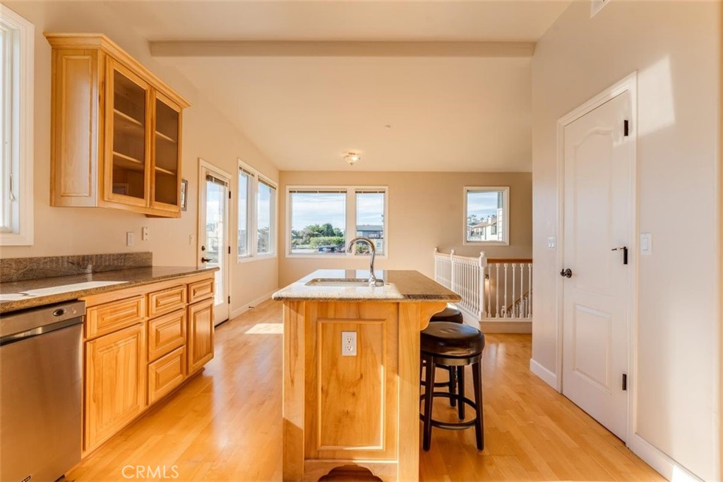 305 Ivar Street Cambria, CA 93428 - Photo 26 of 69 a open kitchen with stainless steel appliances granite countertop a stove and a refrigerator