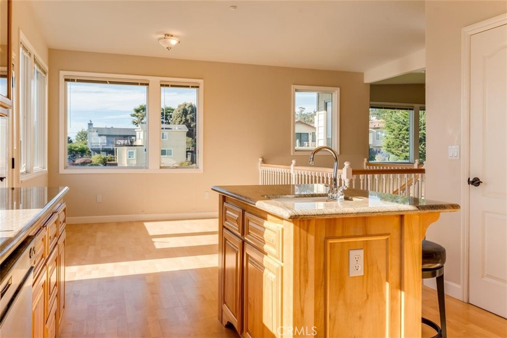 305 Ivar Street Cambria, CA 93428 - Photo 28 of 69 a kitchen with a sink stove and cabinets