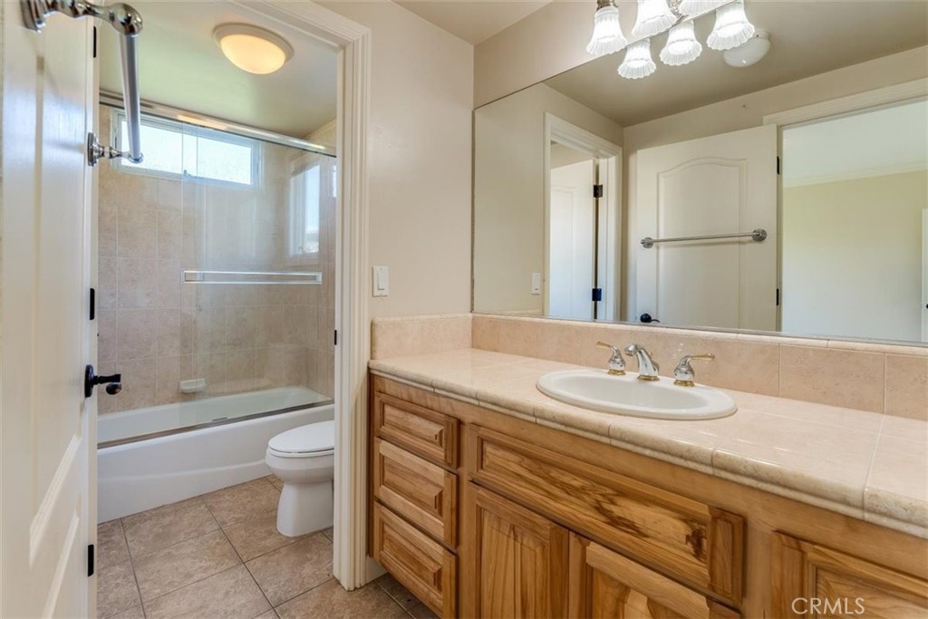 305 Ivar Street Cambria, CA 93428 - Photo 45 of 69 a bathroom with a granite countertop sink toilet and shower