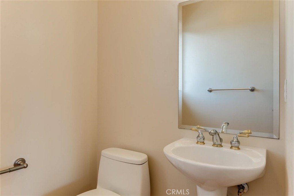 305 Ivar Street Cambria, CA 93428 - Photo 48 of 69 a bathroom with a sink a toilet and mirror