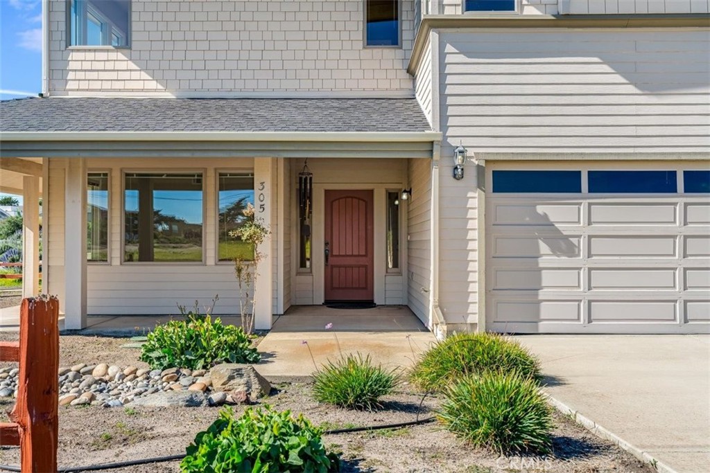 305 Ivar Street Cambria, CA 93428 - Photo 5 of 69 a front view of a brick house with a large windows