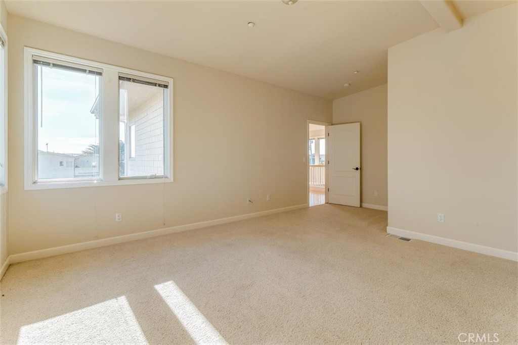 305 Ivar Street Cambria, CA 93428 - Photo 51 of 69 an empty room with windows and closet