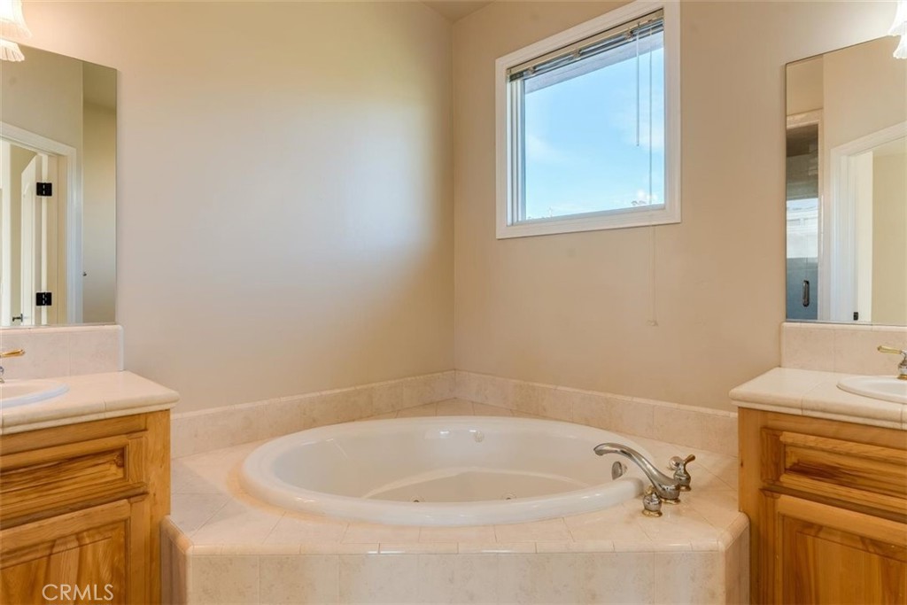 305 Ivar Street Cambria, CA 93428 - Photo 52 of 69 a bathroom with a tub sink and vanity