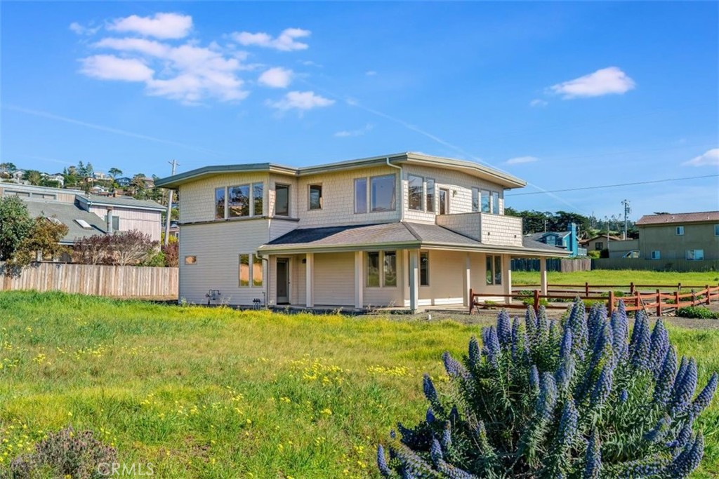 305 Ivar Street Cambria, CA 93428 - Photo 60 of 69 a front view of a house with a yard table and chairs