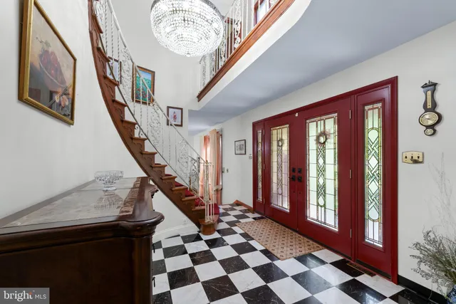 a view of a dining room with furniture a fireplace and wooden floor