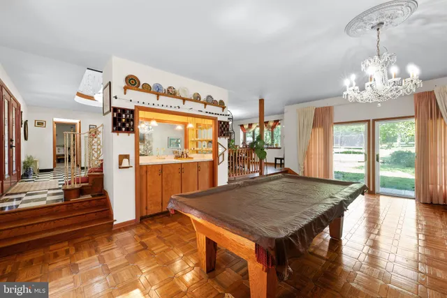 a spacious bedroom with a bed and a fireplace