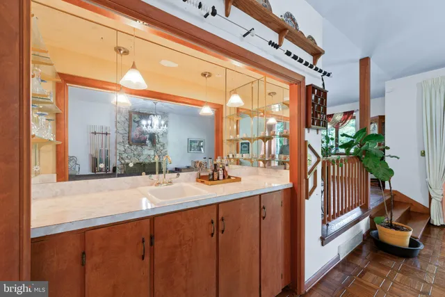 a living room with furniture windows and wooden floor