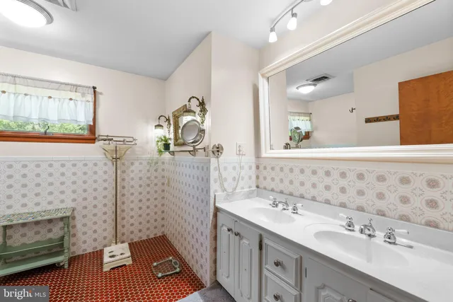 a bathroom with a bathtub and a shower curtain