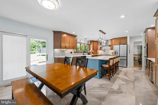 a view of a dining room with furniture and a window