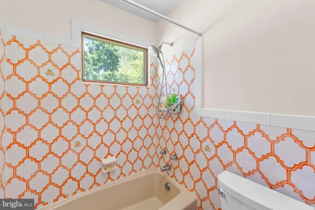 a bed room with furniture and a window