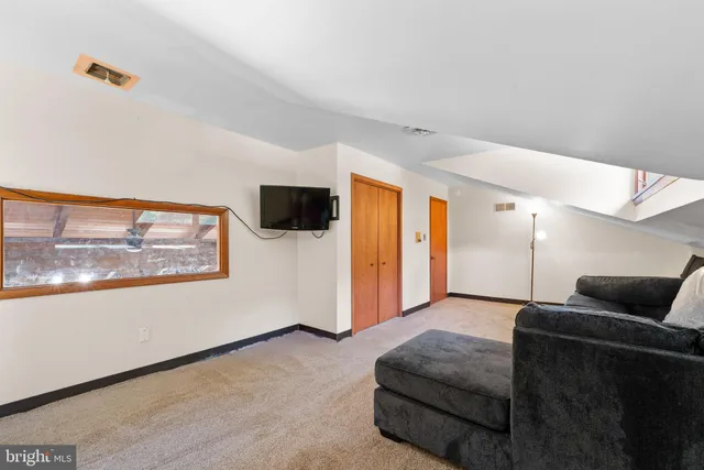 a view of a storage and utility room with washer and dryer