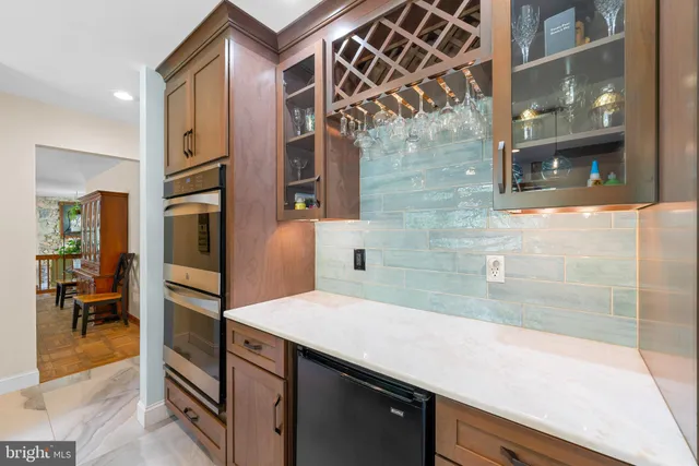 a view of a kitchen with a sink and cabinets