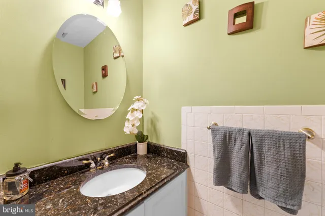a patio with a table and chairs under an umbrella