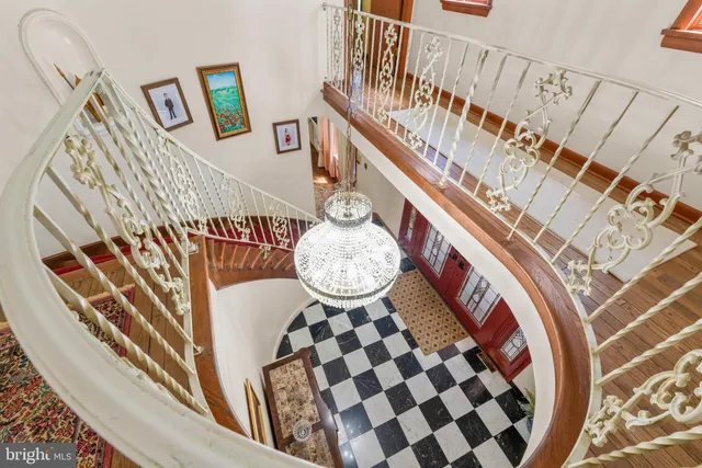 an aerial view of house with swimming pool and outdoor space