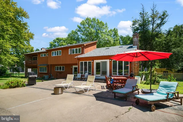 an aerial view of a house with an outdoor space