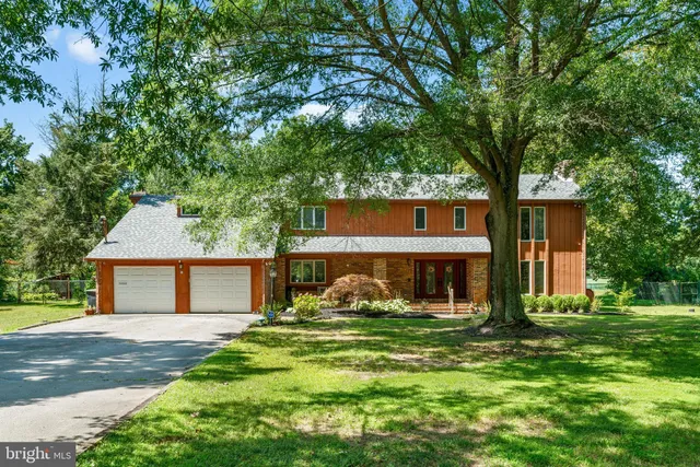 a view of living room with furniture and a fireplace