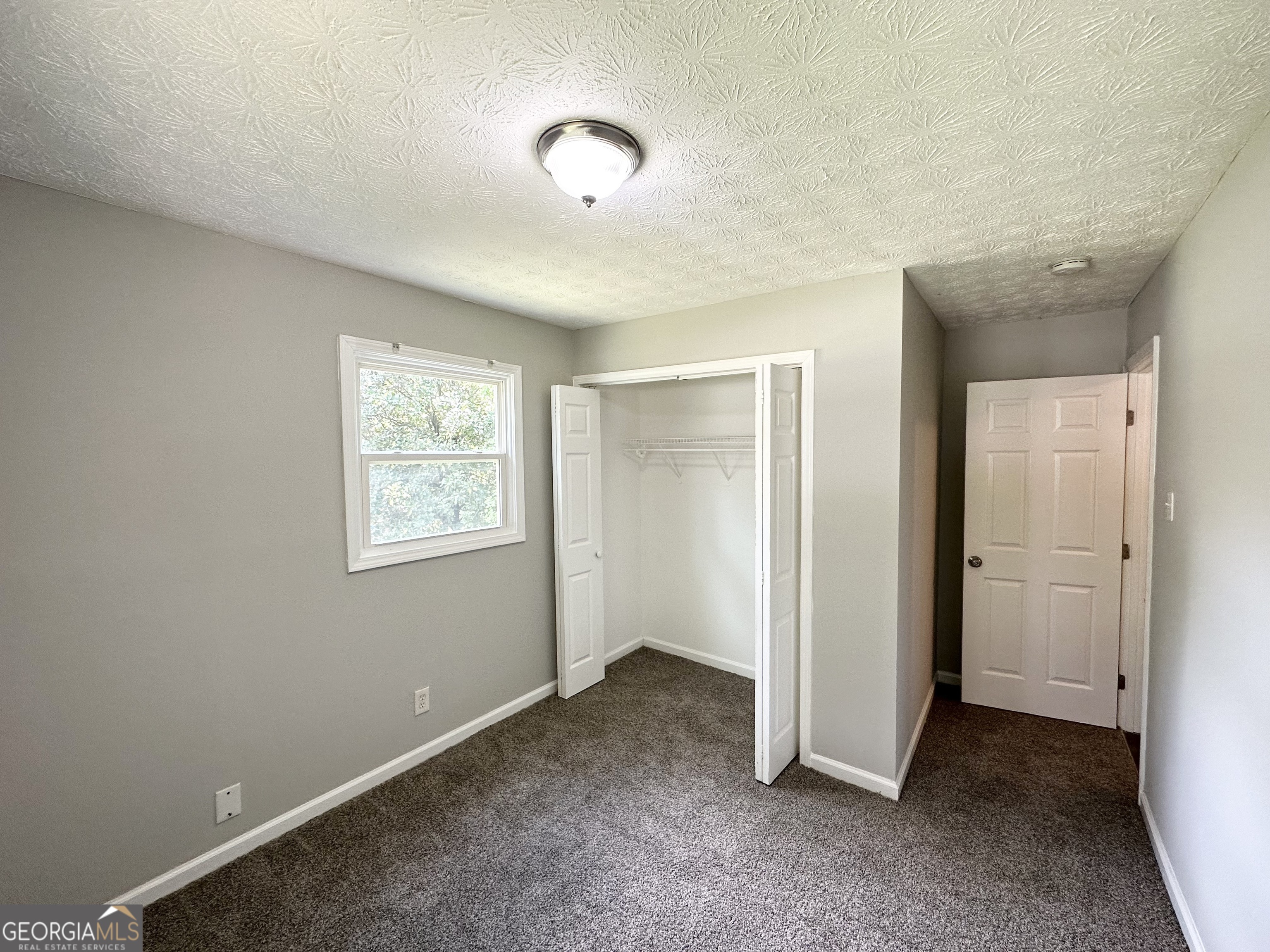 3798 Bakers Ferry Road Southwest Atlanta, GA 30331 - Photo 12 of 21 an empty room with windows
