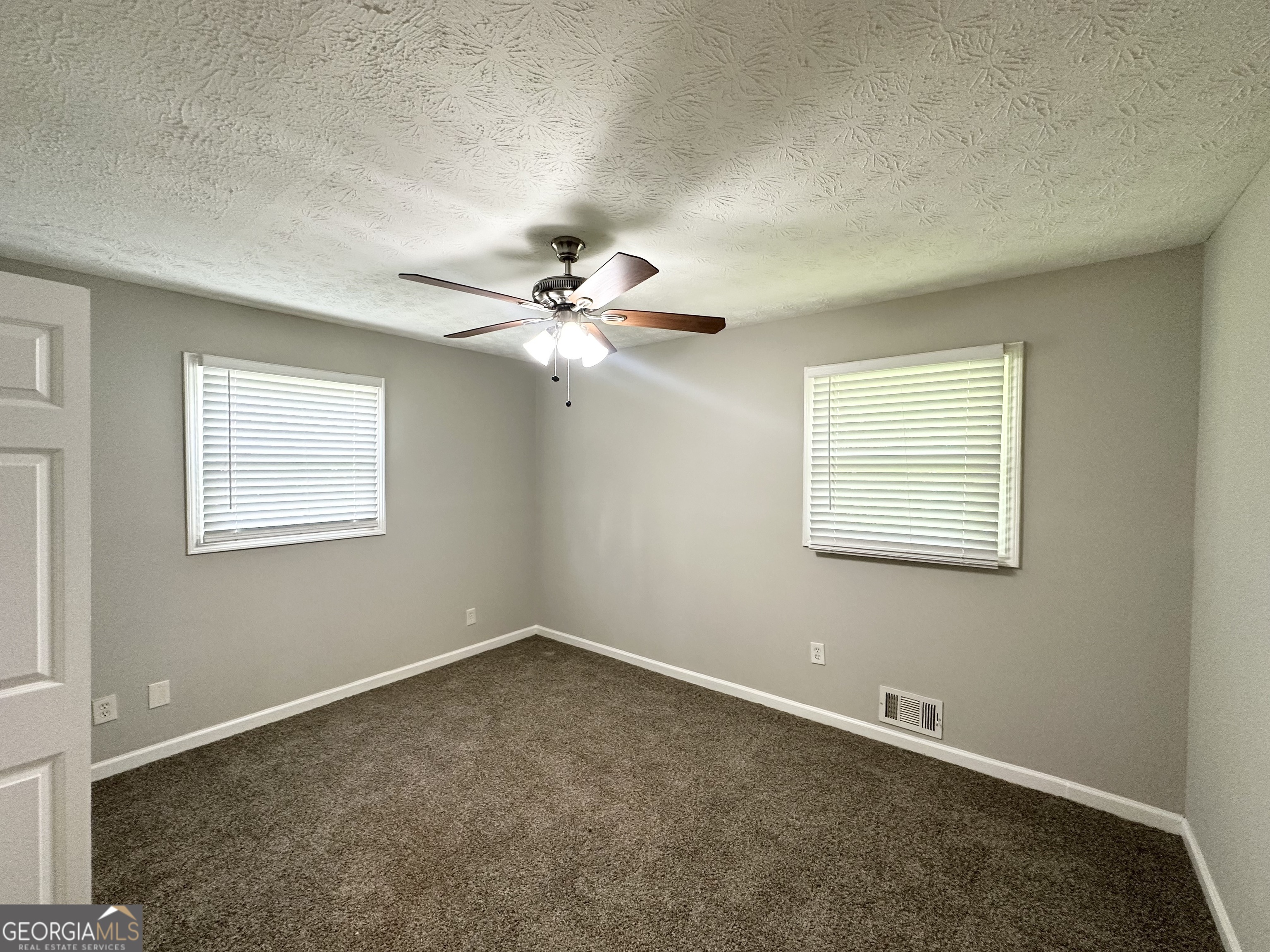 3798 Bakers Ferry Road Southwest Atlanta, GA 30331 - Photo 13 of 21 a view of an empty room with a window