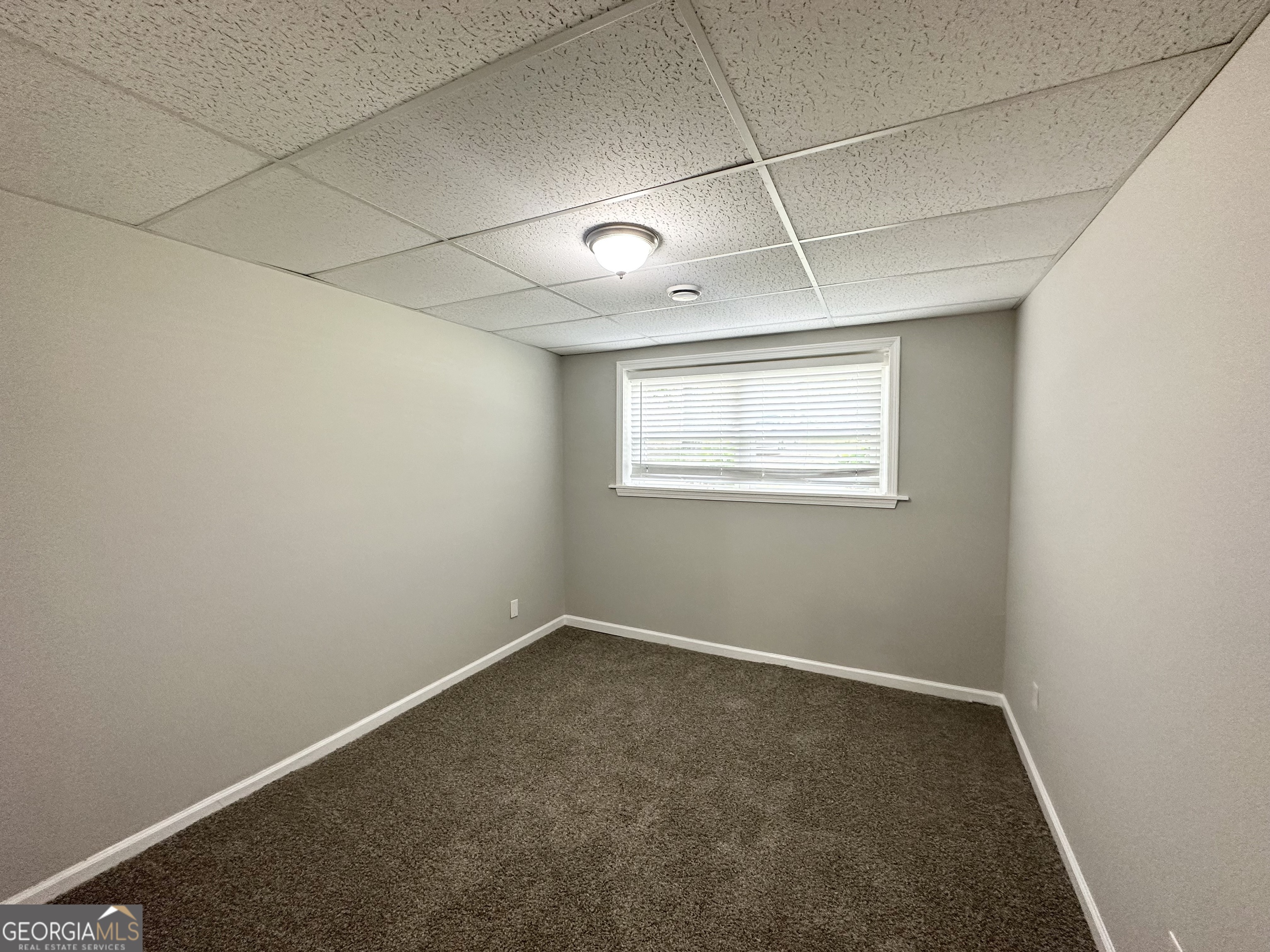 3798 Bakers Ferry Road Southwest Atlanta, GA 30331 - Photo 15 of 21 an empty room with windows