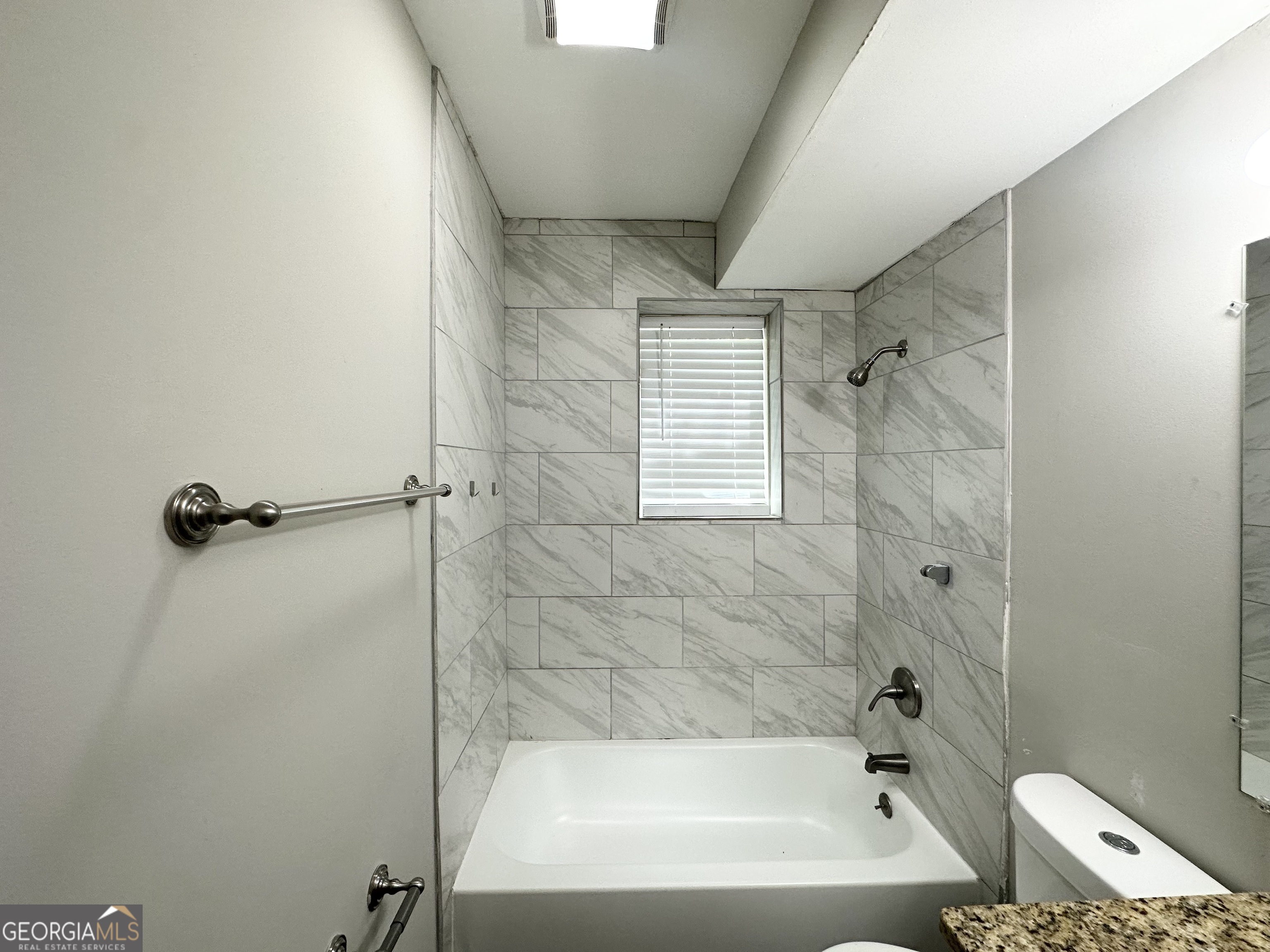 3798 Bakers Ferry Road Southwest Atlanta, GA 30331 - Photo 19 of 21 a bathroom with a bathtub and shower