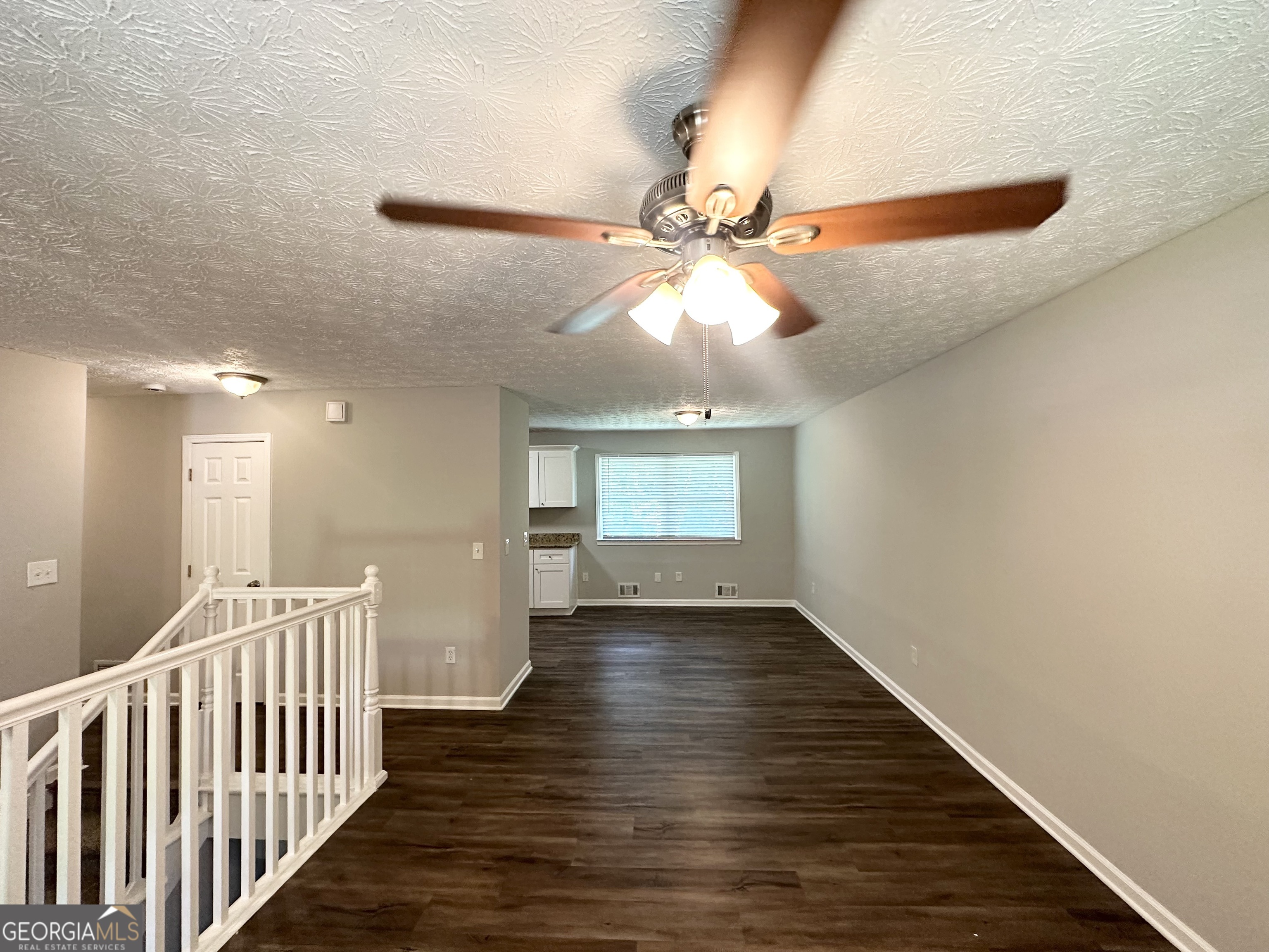 3798 Bakers Ferry Road Southwest Atlanta, GA 30331 - Photo 2 of 21 wooden floor in an empty room with a window