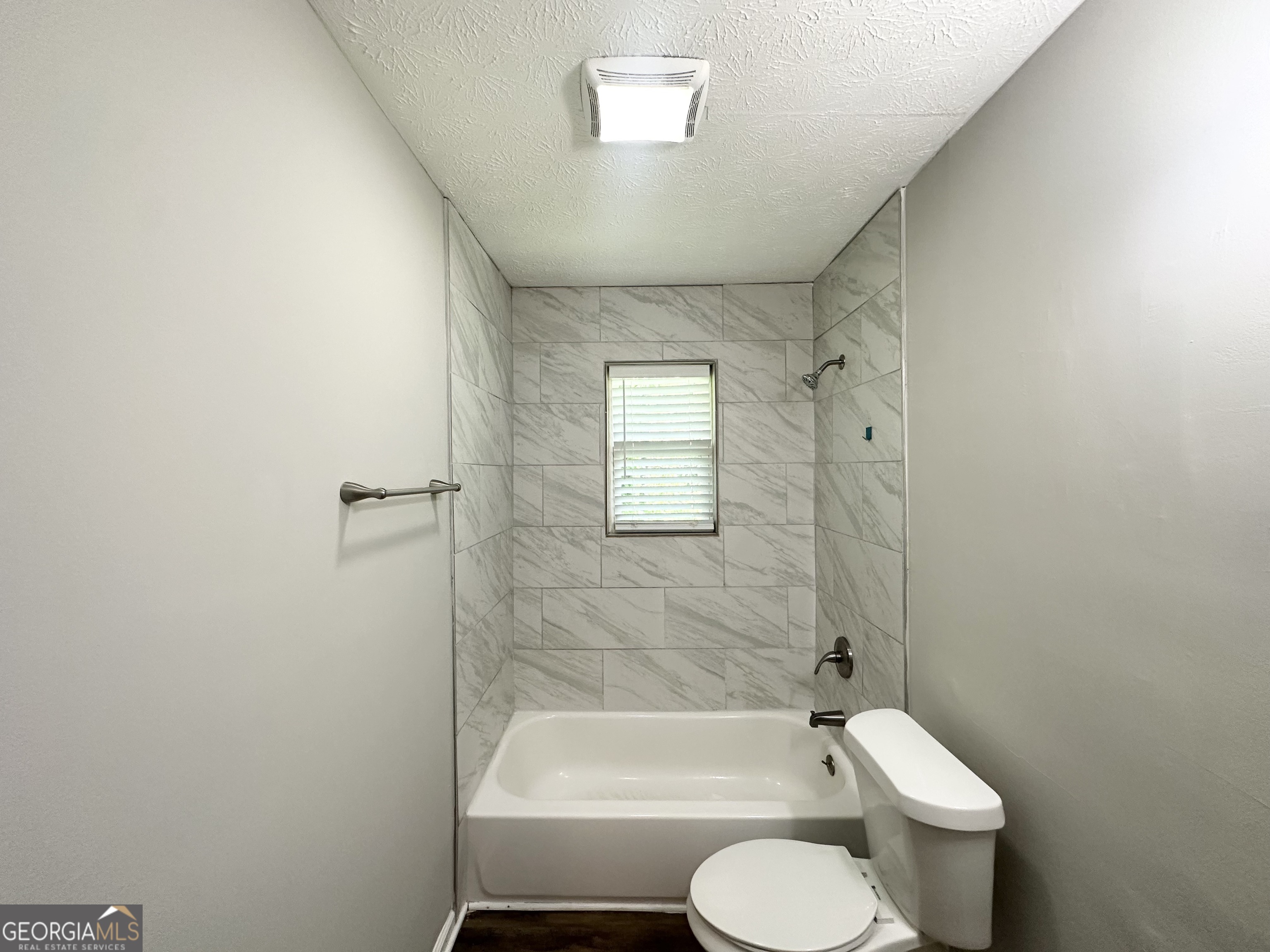 3798 Bakers Ferry Road Southwest Atlanta, GA 30331 - Photo 8 of 21 a bathroom with a toilet sink and shower