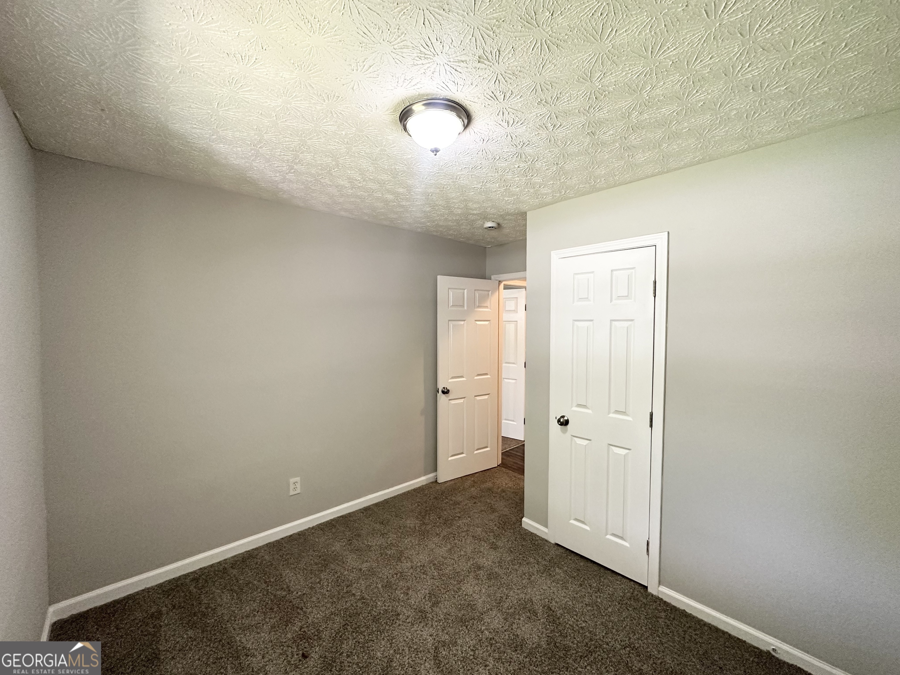 3798 Bakers Ferry Road Southwest Atlanta, GA 30331 - Photo 10 of 21 an empty room with a mirror