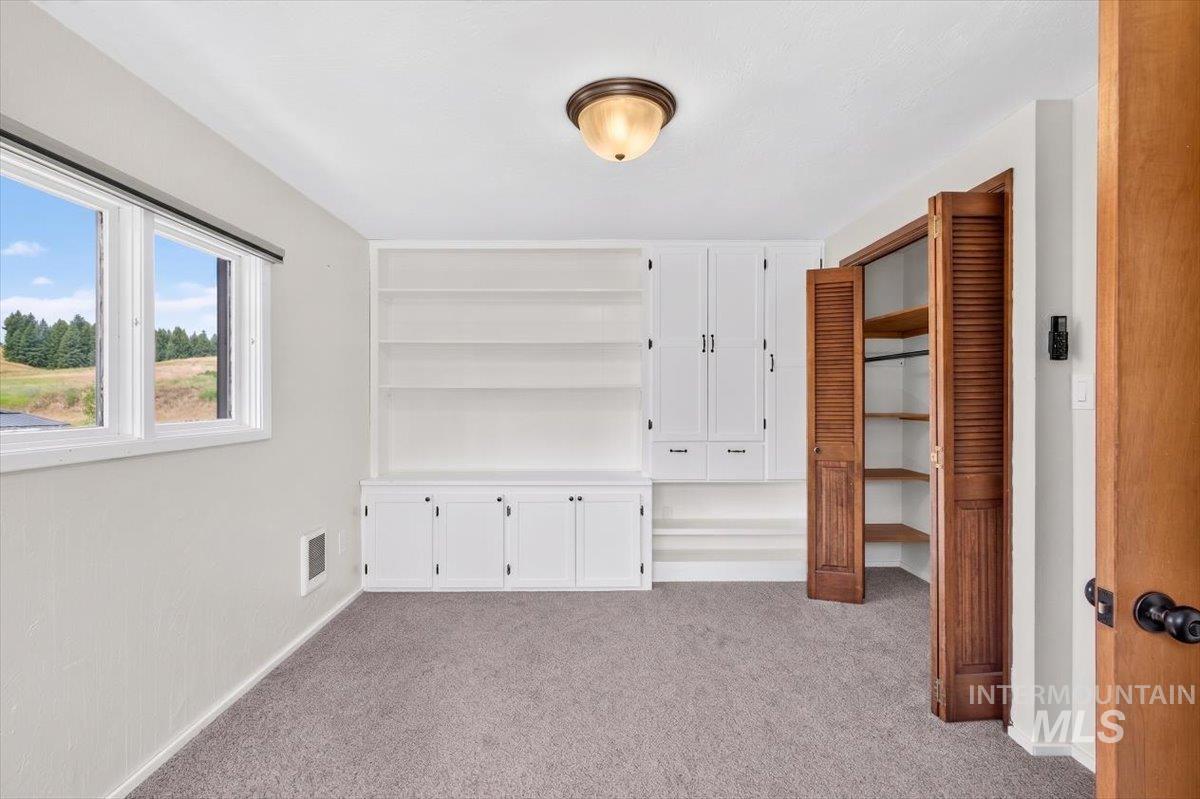 1071 Reynolds Road Princeton, ID 83857 - Photo 11 of 12 Room featuring neutral carpeting and white walls