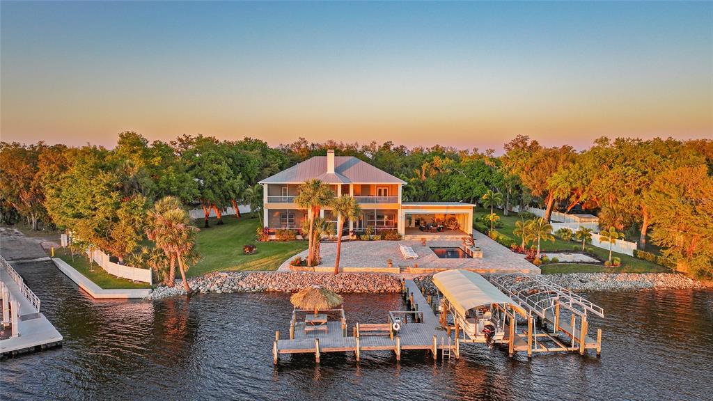 an aerial view of a house with wooden fence