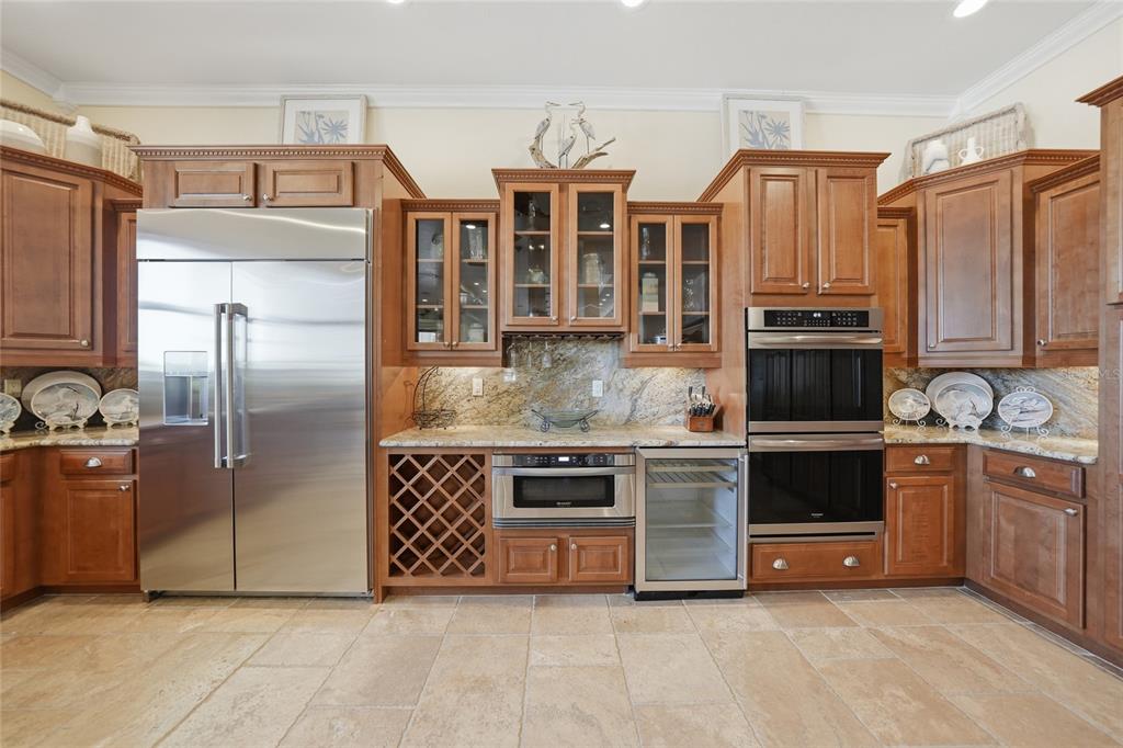 8635 Southwest Riverside Drive Arcadia, FL 34269 - Photo 13 of 70 a kitchen with stainless steel appliances granite countertop a stove and a refrigerator