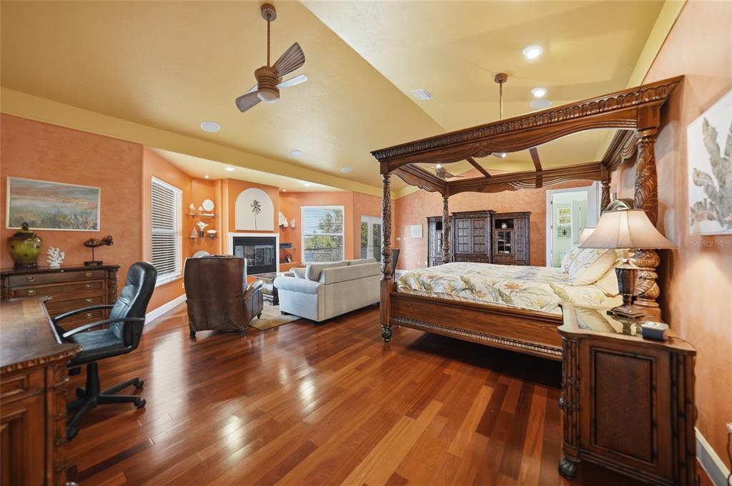 8635 Southwest Riverside Drive Arcadia, FL 34269 - Photo 20 of 70 a bedroom with furniture large window and wooden floor