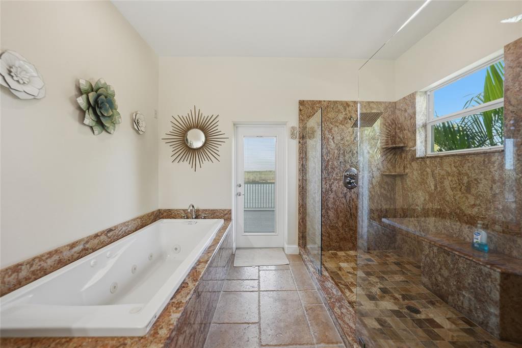 8635 Southwest Riverside Drive Arcadia, FL 34269 - Photo 25 of 70 a bathroom with a tub sink and shower