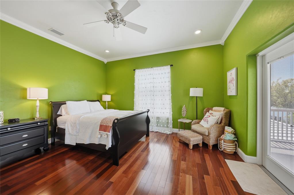 8635 Southwest Riverside Drive Arcadia, FL 34269 - Photo 28 of 70 a spacious bedroom with a bed and a chair