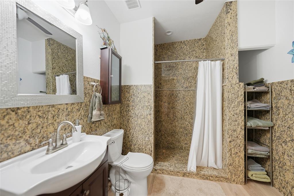 8635 Southwest Riverside Drive Arcadia, FL 34269 - Photo 33 of 70 a bathroom with a sink toilet and shower