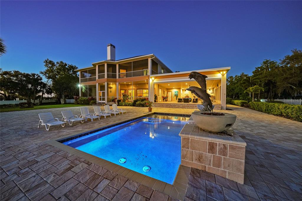 8635 Southwest Riverside Drive Arcadia, FL 34269 - Photo 5 of 70 a view of swimming pool with outdoor seating and yard in back